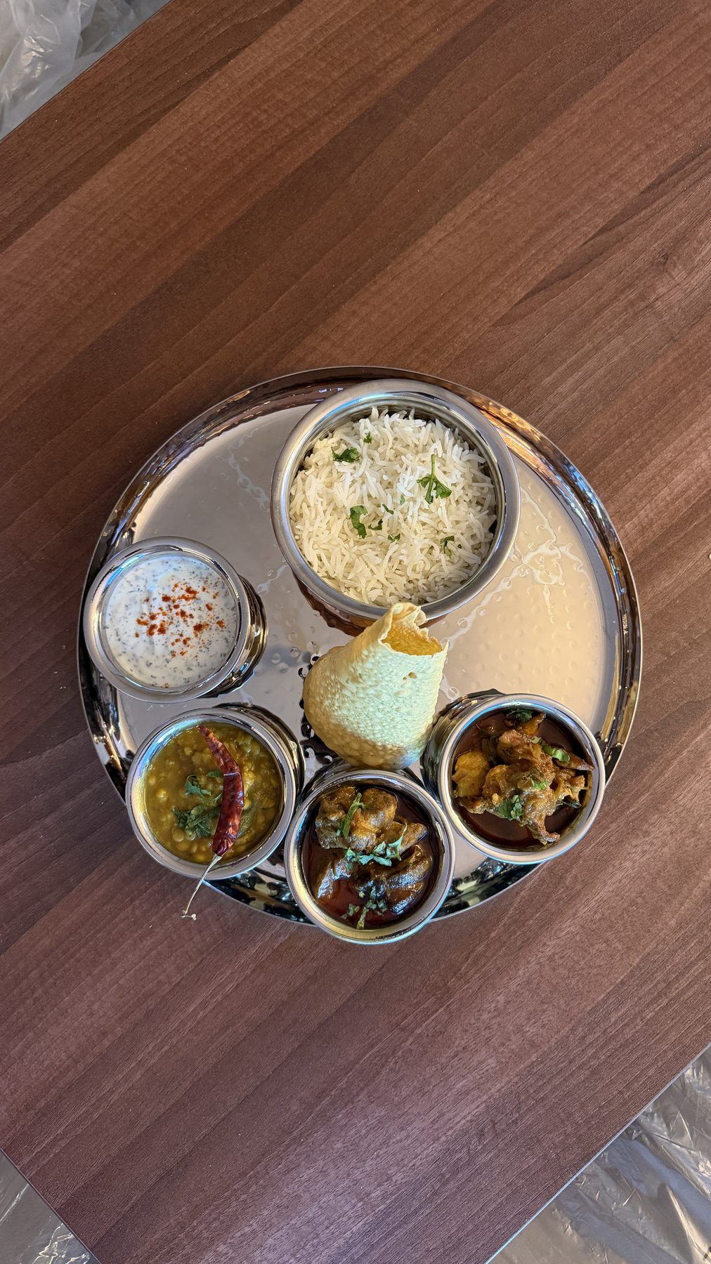 Curry thali with rice and poppadom
